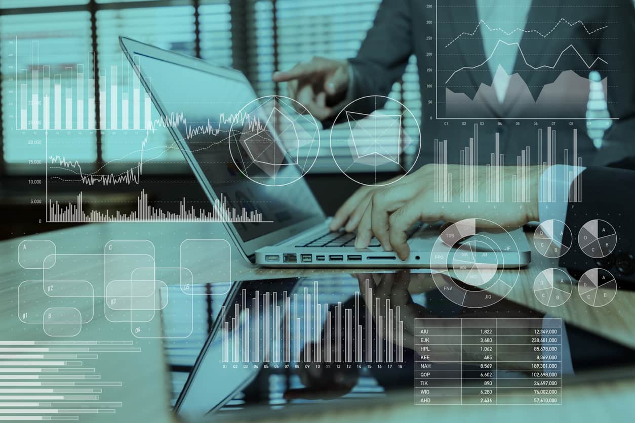 An image of an employee doing an online training on a laptop in this article about reasons to automate training.