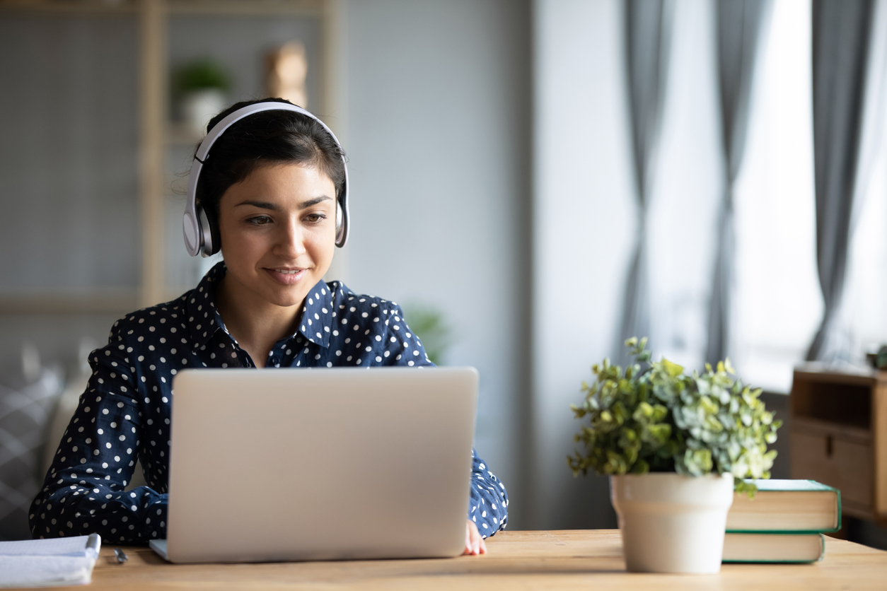 A salesperson working from home, isolated, trying to make virtual connections.
